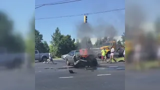 DRAMATIC VIDEO: Person rescued from burning car on Suitland Parkway in Maryland as bystanders attemp