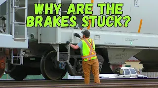 Brakes are stuck on a grain car and the conductor has to find it on a long freight train