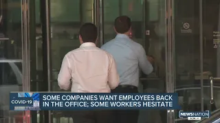 Some companies want employees back in the office; some workers remain hesitant