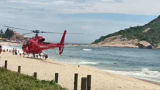 Helicóptero pousando e decolando na Praia