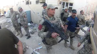 The Man in the Arena QR Code 23: Navy SEAL Eddie Gallagher administering treatment of ISIS Fighter