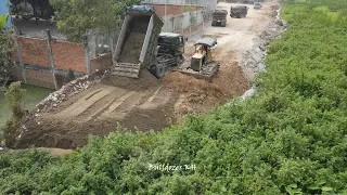 Nice Amazing Mighty Bulldozer Pushing Soil Stone to water build New Road with 5 Ton Truck Unloading