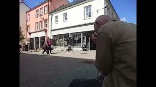 really slow, soulful blues harmonica busking, cut short by the arrival of a pretty lady...haha