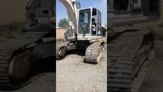 The big white atlas excavator at work