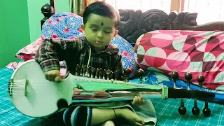 Teaching Sarod to a kid - my current youngest disciple age 5 years