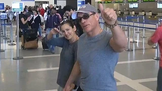 X17 EXCLUSIVE - Jean-Claude Van Damme Catches Flight At LAX With Wife Gladys Portugues