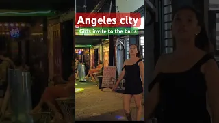 Angeles city. Girls invite to the bars. Walking Street.