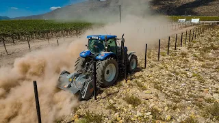 FAE STC200DT PTO Stone Crusher machine behind New Holland T7040 tractor crushing rocks in vineyards