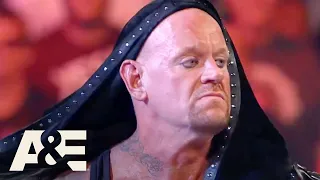 WWE's Most Wanted Treasures: Undertaker Gets TRAPPED In His Coat | A&E