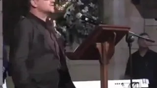 U2's Bono singing "I Still Haven't Found What I'm Looking For" with a Gospel Choir