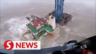 Video shows crew members being rescued from ship that snapped two in Typhoon Chaba