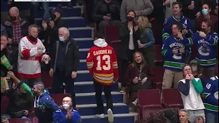 Calgary Flames' fan walks out after the Canucks lights up the Flames 7 - 0