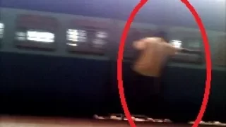 THIS IS WHY PEOPLE GET KILLED BY TRAINS :  STUPID STUNTS ON MOVING TRAINS !!