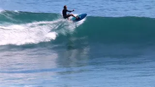 sup surfing Uluwatu