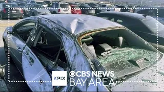 Tire smashes parked car after falling off jet departing SFO