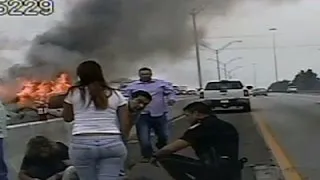 Raw: Officer Helps Save Woman From Burning Car