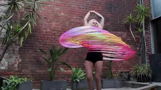 Woman Shows Amazing Skills with Multiple Hula Hoops - 1097056