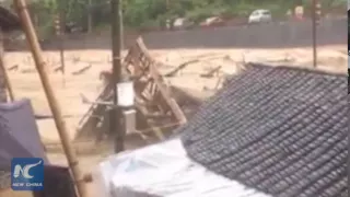 RAW: Homes swept away by flash floods in ethnic region in central China