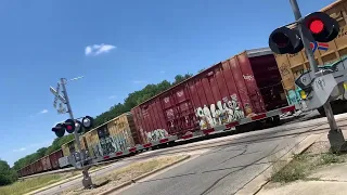 Northbound Union Pacific auto/box car train at dittmar road in Austin Texas with mid and rear DPU