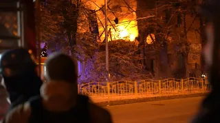 Firemen extinguish fire following strikes on Ukraine's Zaporizhzhia | AFP