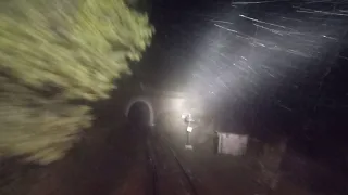 Live scary view from train driver cab at night Heavy raining lightning and thunderstorm in mountains