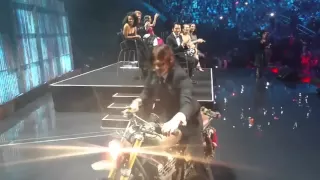 Norman arrives on bike