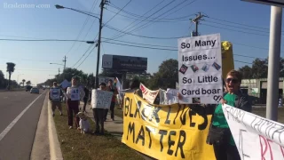 Protesters outside MacDill AFB ahead of President Donald Trump's visit