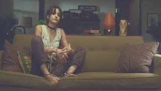 Celebrity in Chains - Stacy Martin (Rosy Monroe) sitting in shackles with her barefoot in "Rosy"