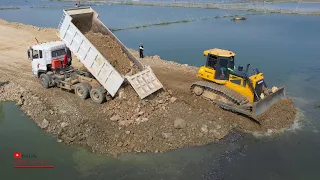 Best Construction Bulldozer Pushing Soils In Water Building Road With Dump Truck Unloading