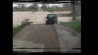 This lady tried to cross a flooded street and failed!