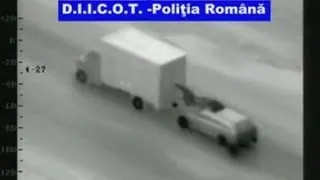 Romanian gang attempt truck robbery from bonnet of moving car