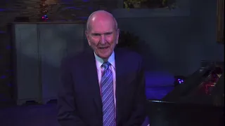 President Nelson playing “Hope of Israel” on the piano