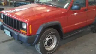 1999 Red Jeep Cherokee - 31,930 Miles