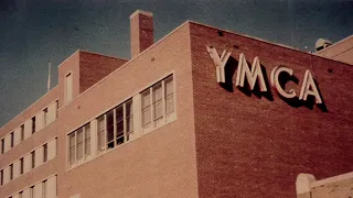it’s 1978 and ymca by village people is heard playing from an open window outside the local ymca