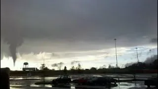 Small tornado eats parking lot