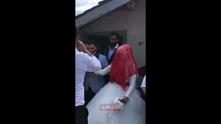 Bride and guests fire guns at wedding