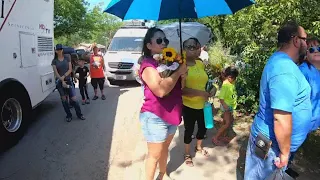 Long line forms to give flowers and pay respects at memorial near Uvalde school