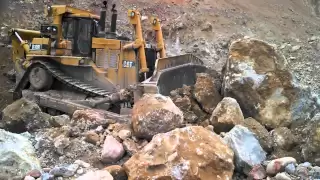 Caterpillar D10R Pushes a Massive Boulder