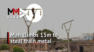 Lockdown loot: Thief climbs 15m pole to 'steal' valuable train metal in broad daylight