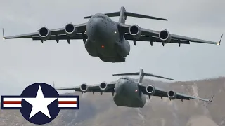 US Air Force. Powerful C-17 Globemaster III low-level flying over mountainous terrain.