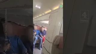 Plane door opens mid air