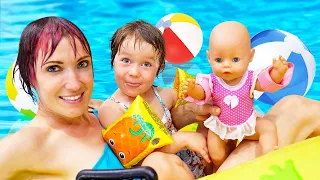 Kids play dolls & swimming at the water park. Baby Annabell doll at the swimming pool & jacuzzi.