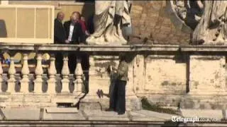 Protester climbs up apostolic palace during Pope's mass