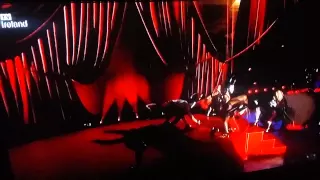 Madonna gets dragged off the stage during the BRIT