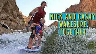 DAD AND DAUGHTER WAKE SURF TOGETHER