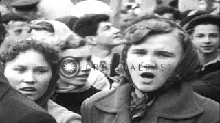 A large crowd of civilians with Soviet flags and posters of their leaders sing so...HD Stock Footage