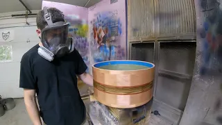 Spraying lacquer on drum shells