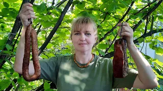 Smoking meat and sausages in a wood smoker and cooking a traditional horseradish seasoning