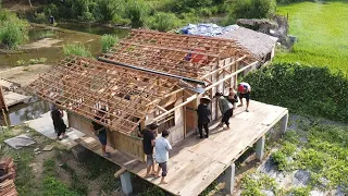 The whole Village came to help the KONG family move the wooden house to a new, safer location