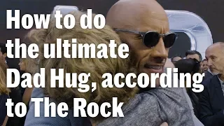 The Rock Taught Us How to Do the Ultimate Dad Hug